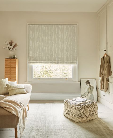 Flow Sesame roman blind in a dressing room window 