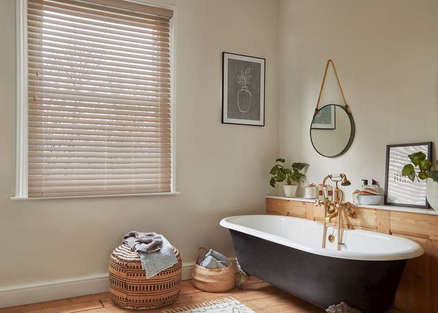 Zen White faux wood venetian blind in a bathroom window.  