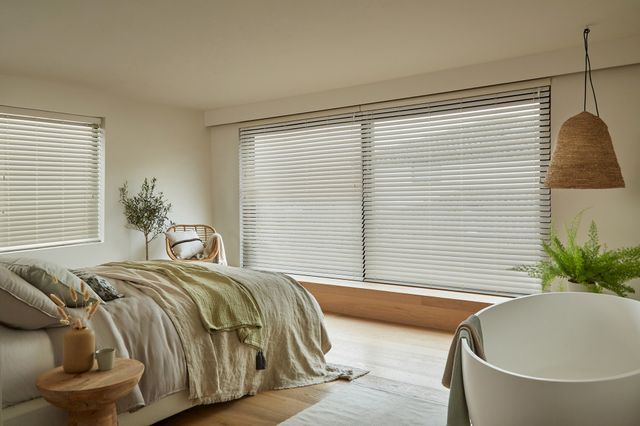 Zen Whisper faux wood venetian blind in a bedroom window 