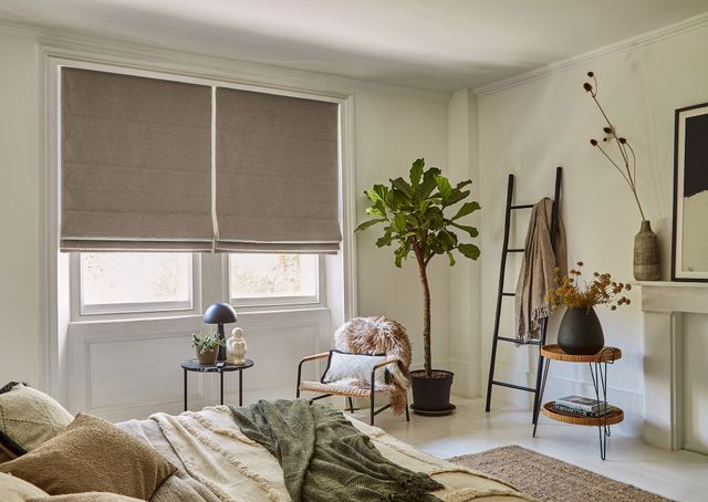 sulby brush roman blinds in a white decorated bedroom