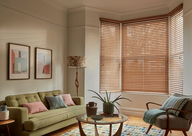 Mirage rich oak faux wood venetian blinds in living room bay window