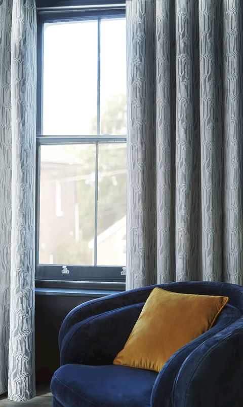 Maud steel floor length eyelet curtains in dark themed bedroom