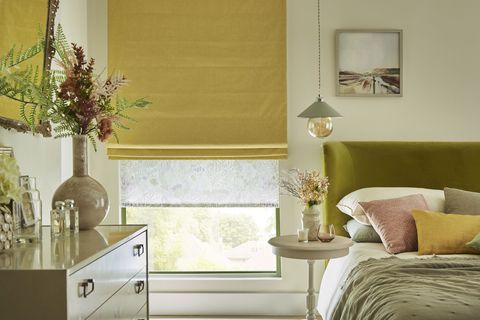 Harper sunshine roman blinds paired with daisy spring roller blinds in pastel themed bedroom