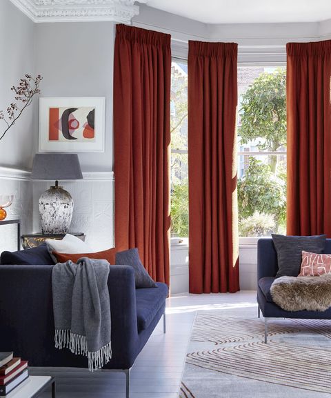 Two pairs of soho boucle spice pinch pleat curtains in bay window in living room
