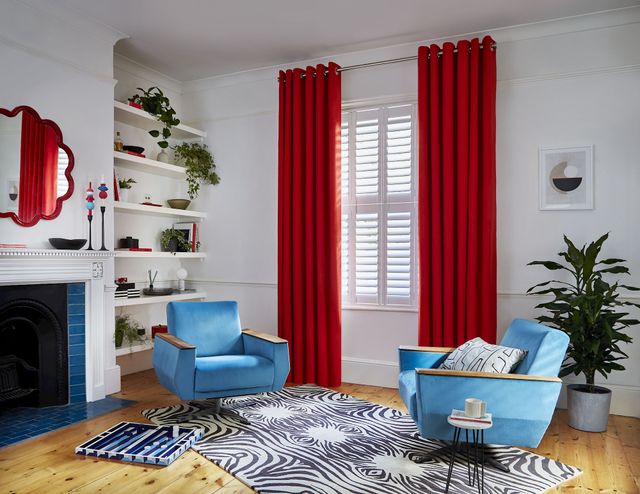 Faso fiesta floor length eyelet curtains paired with white shutters in modern living room