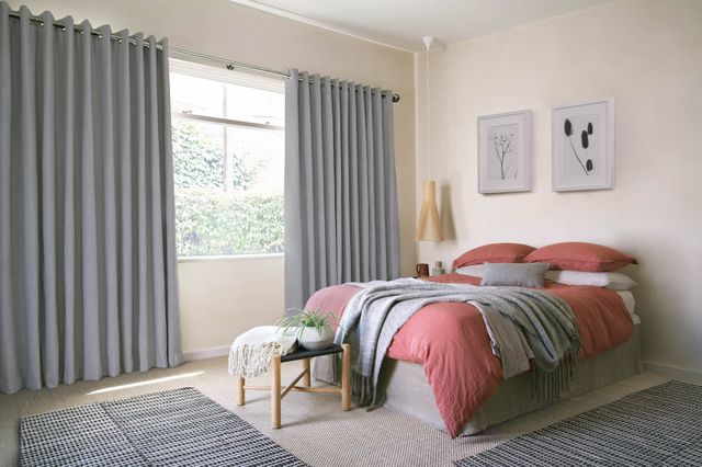 Bailey cloudy floor length eyelet curtains in cosy bedroom