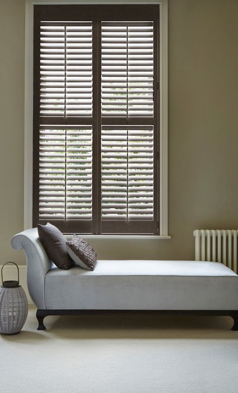 rustic black full height dalston shutters in living room with chaise long