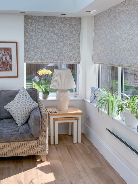 grey leafy roman blind on conservatory windows