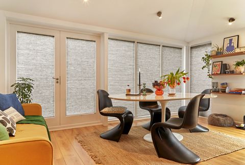 full closed grey duette pleated blinds on french doors and large windows in modern dining area