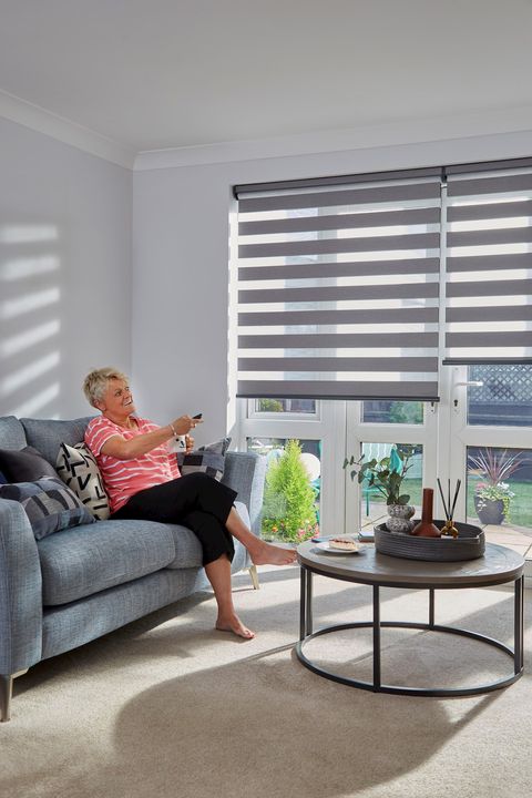 Dark grey day and night blinds on french doors in living room