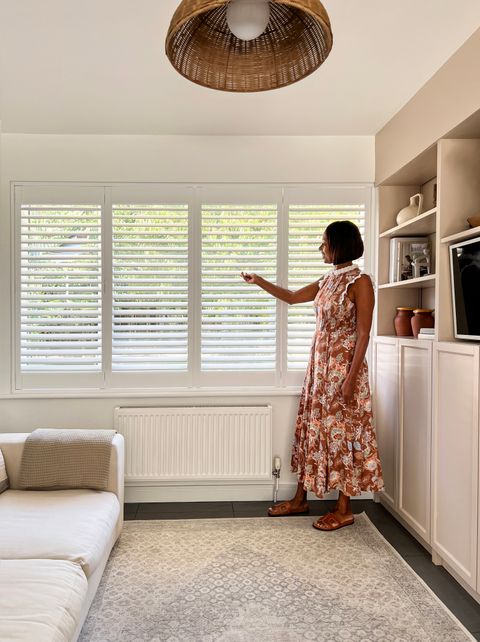 Isa chadborn in cream themed room with pure white shutters on windows