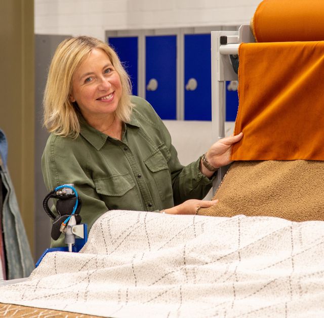 Yvonne kneel product designer holding roman blind