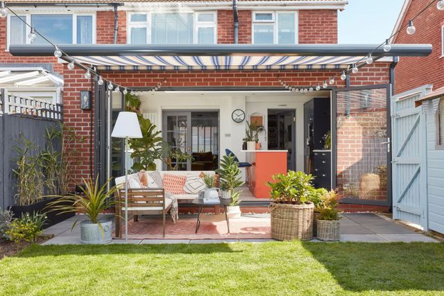 rome blue motorised awning in garden